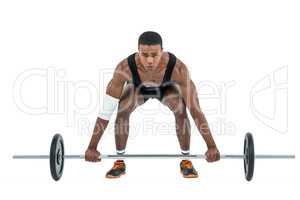 Bodybuilder lifting heavy barbell weights