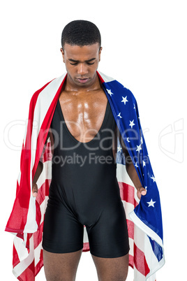 Athlete with american flag wrapped around his body