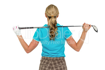 Rear view of golf player holding a golf club