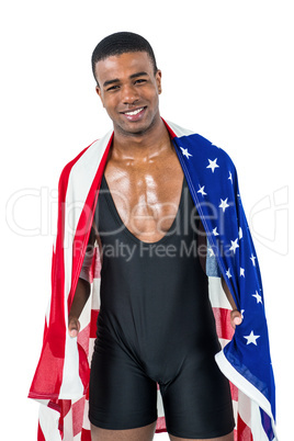 Athlete with american flag wrapped around his body