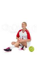 Sportswoman touching her knee