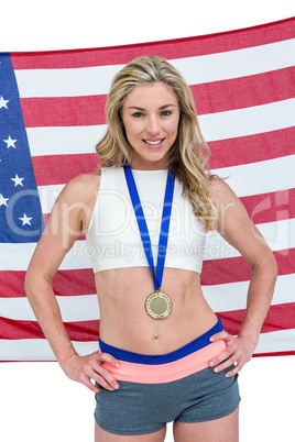 Athlete posing with gold medals around his neck