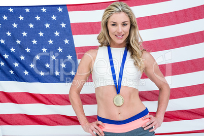 Athlete posing with gold medals around his neck