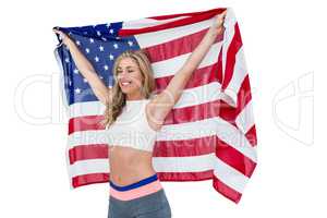 Athlete posing with american flag after victory