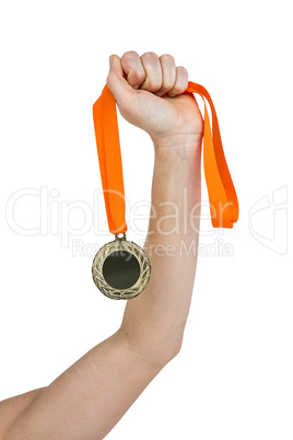 Athlete holding gold medal after victory