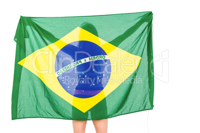 Athlete posing with brazilian flag after victory