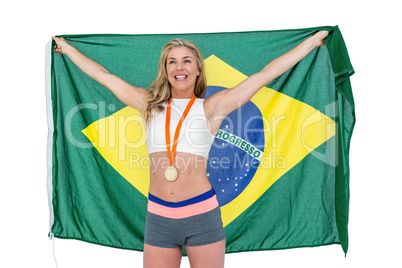 Athlete posing with gold medal after victory