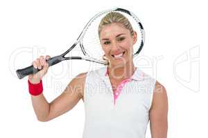 Portrait of happy athlete holding racquet