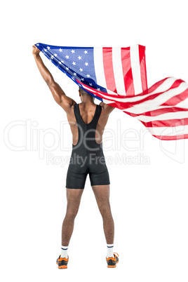 Athlete posing with american flag after victory