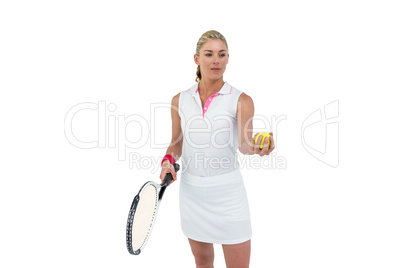 Athlete holding a tennis racquet ready to serve