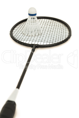 Badminton racket with feather shuttlecock on white background