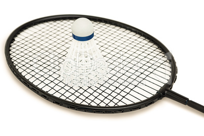 Badminton racket with feather shuttlecock on white background