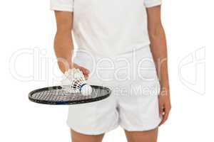 Athlete holding badminton racket and shuttlecock