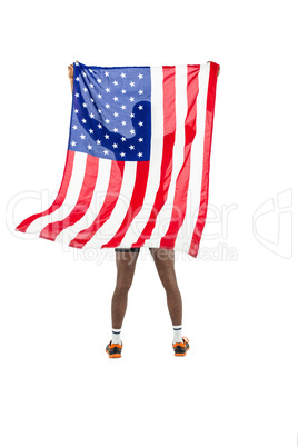 Athlete posing with american flag after victory