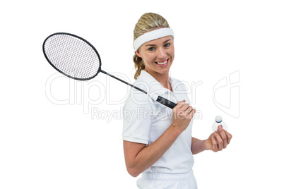 Badminton player holding badminton racket and shuttlecock