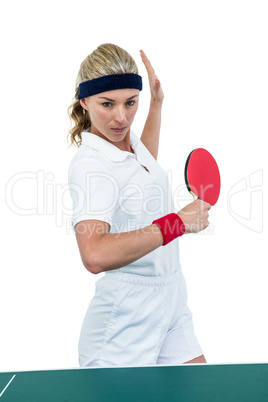 Female athlete playing table tennis