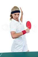 Female athlete playing table tennis