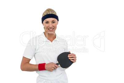 Female athlete holding table tennis paddle