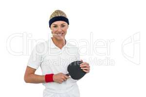 Female athlete holding table tennis paddle