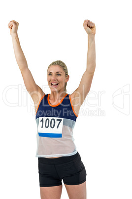 Female athlete posing after victory