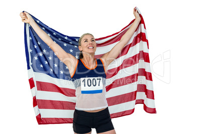 Athlete posing with american flag after victory