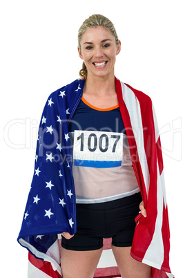 Athlete with american flag wrapped around his body