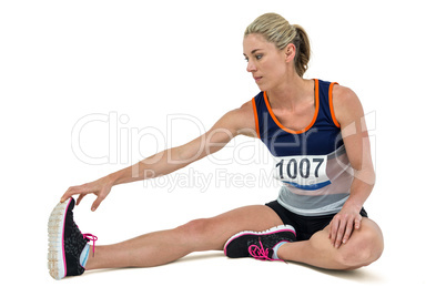 Athletic woman stretching her hamstring