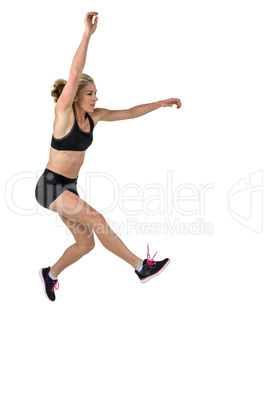 Athletic woman exercising on white background