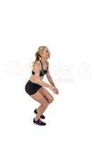 Athletic woman exercising on white background