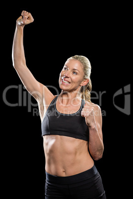 Female athlete posing after victory
