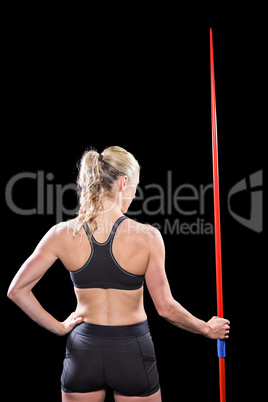 Athlete standing with javelin