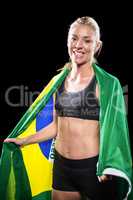 Athlete with brazilian flag wrapped around his body