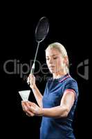 Badminton player holding a racquet ready to serve