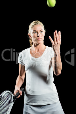 Tennis player holding a racquet ready to serve