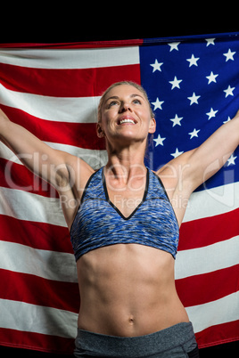 Athlete posing with american flag after victory