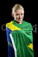 Athlete with brazilian flag wrapped around his body