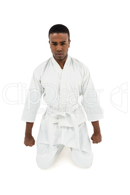 Front view of karate fighter meditating