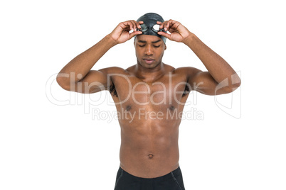 Swimmer holding goggles