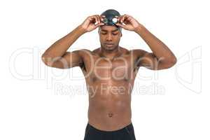 Swimmer holding goggles