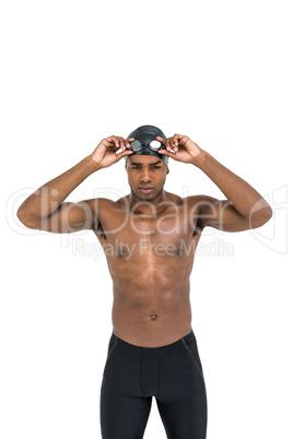 Swimmer holding goggles
