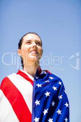 Female athlete wrapped in american flag