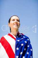Female athlete wrapped in american flag