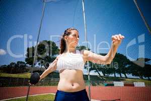 Female athlete about to throw a discus