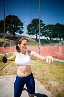 Female athlete about to throw a discus