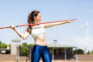 Female athlete about to throw a javelin