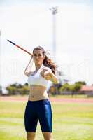 Female athlete about to throw a javelin