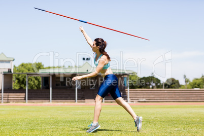 Female athlete throwing a javelin