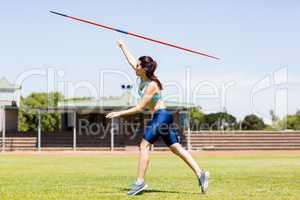 Female athlete throwing a javelin