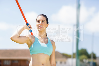 Female athlete about to throw a javelin