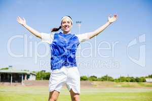 Happy soccer player posing after victory